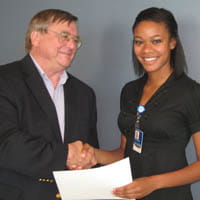biomedical-slideshow1-200-Arnie giving Olivia her certificate